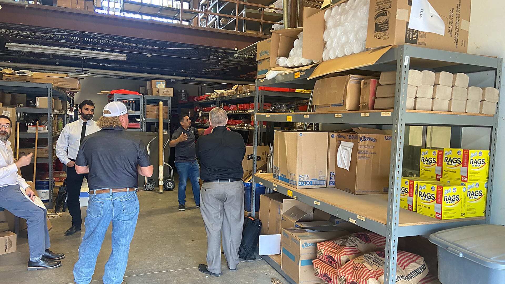 Fleet parts room with overcrowded shelving before Kardex Vertical Lift Module installation in Grapevine Texas