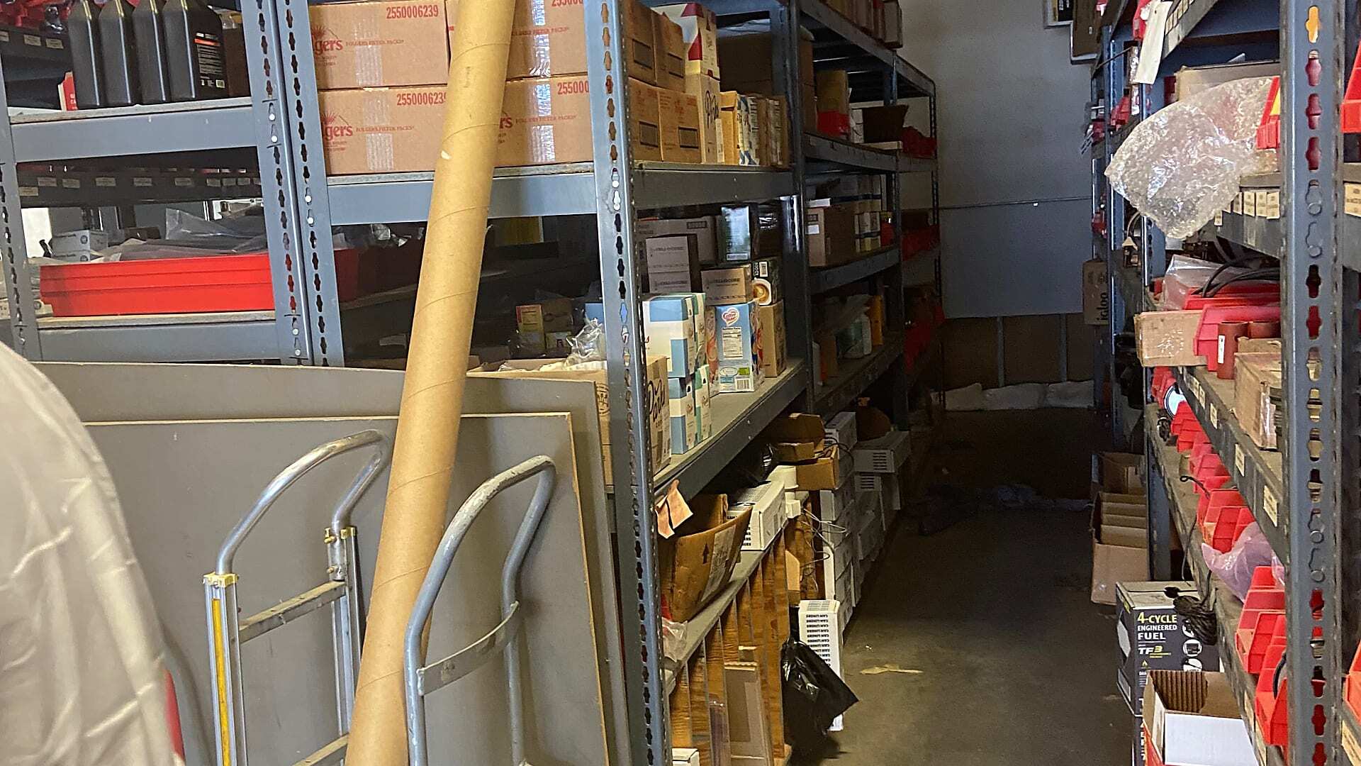 Conventional shelving storing municipal fleet maintenance parts before automation