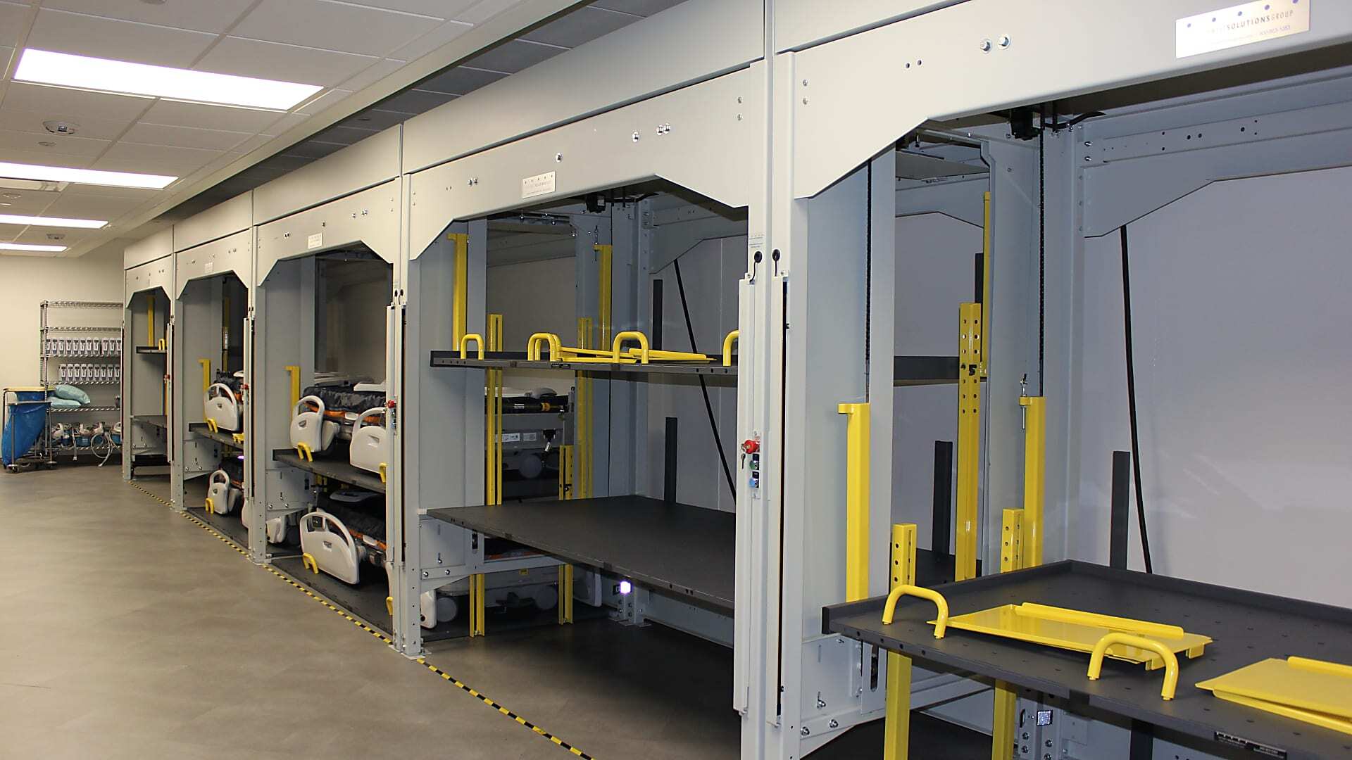 High-density hospital bed storage system improving organization and equipment access