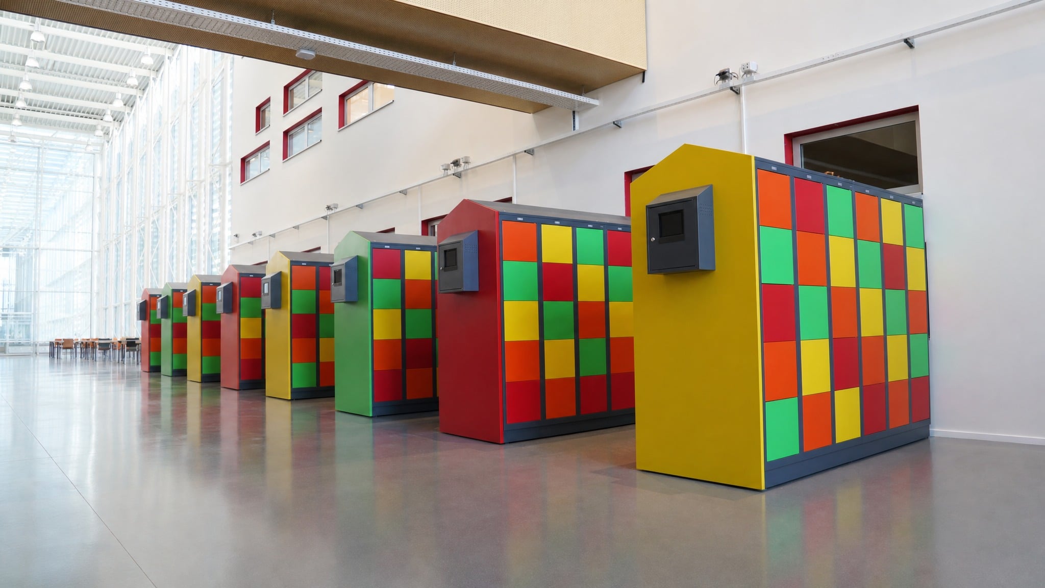 Team planning a smart locker wall installation in a facility