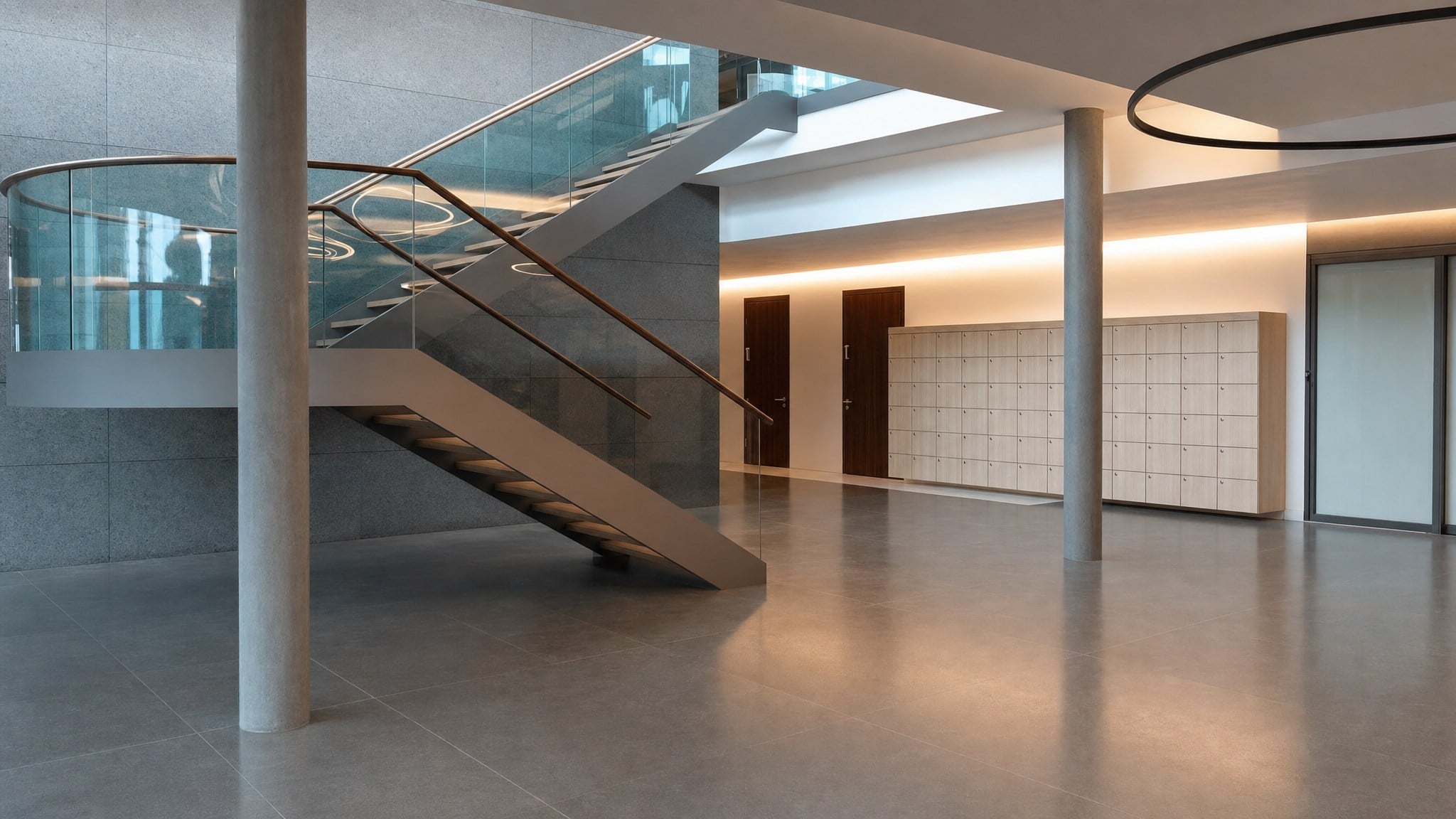 Light wood lockers with multiple compartments in a modern open lobby area.